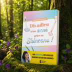 Livre "Dis adieu à ton acné grâce au Skincare !" de Myriam Ben Souilem posé sur de la mousse, illustré avec un roller en quartz rose et une pipette de sérum.