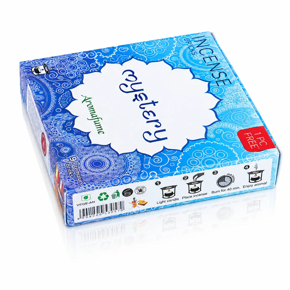 Briques d'encens Mystery Aromafume, boîte rectangulaire bleue aux motifs mandalas, dotée d'un macaron central floral blanc et d'instructions d'utilisation sur la tranche.