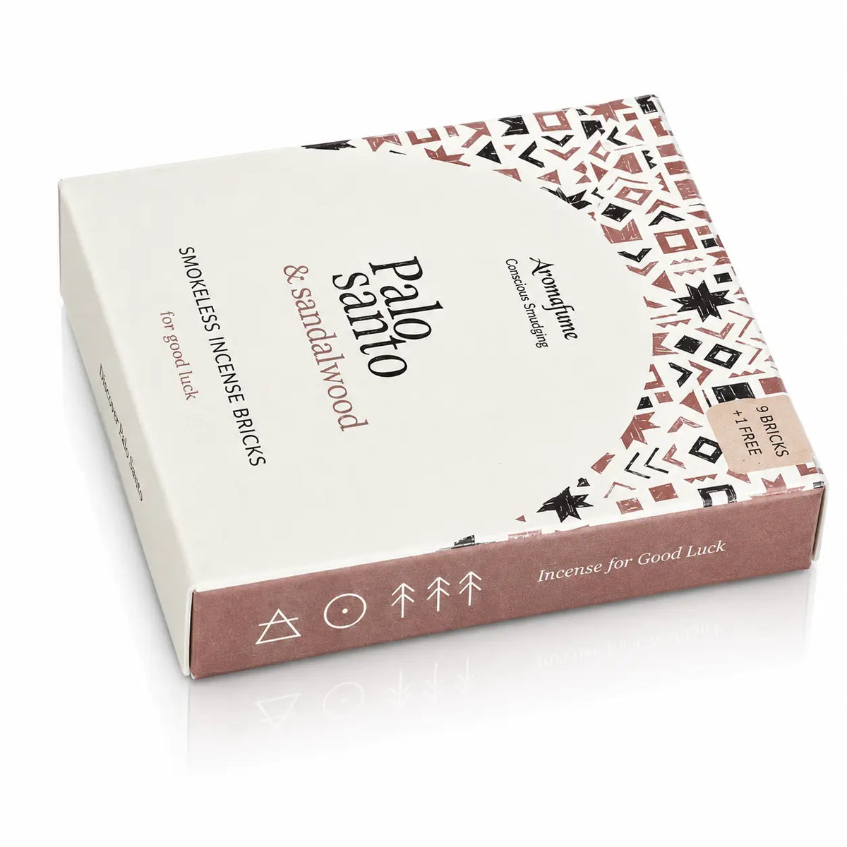 Briques d'encens Palo Santo et bois de santal Aromafume, packaging rectangulaire blanc et rose poudré aux motifs ethniques géométriques avec un demi-cercle central et tranche vieux rose.