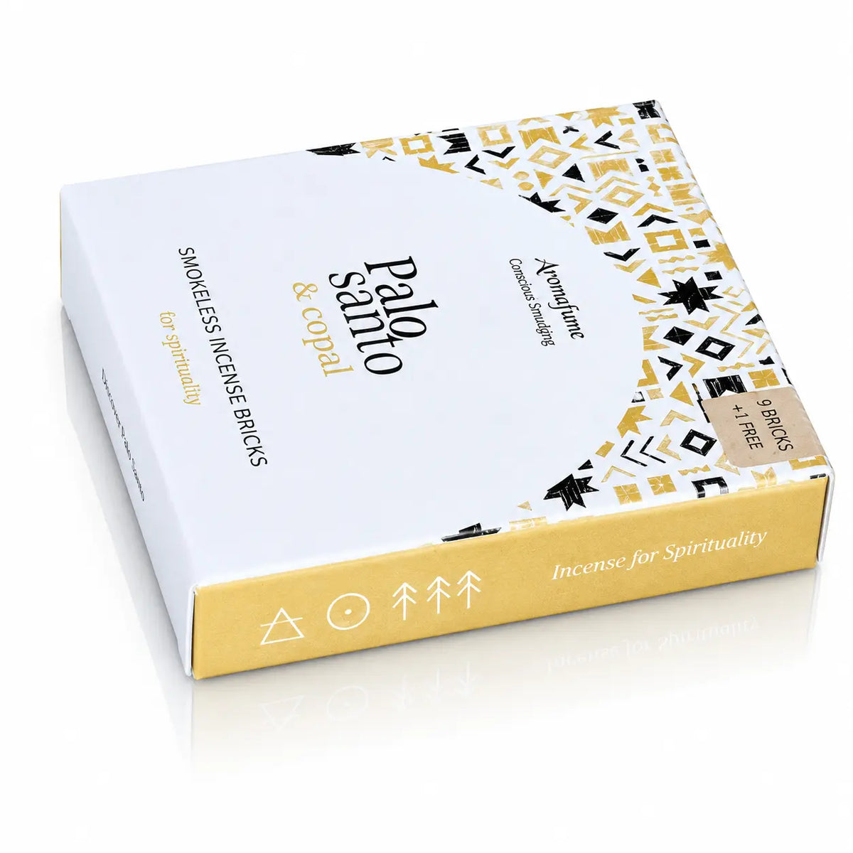 Briques d'encens Palo Santo et copal Aromafume, packaging rectangulaire blanc et jaune orné de motifs géométriques ethniques avec un demi-cercle central et tranche dorée.