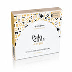 Briques d'encens Palo Santo et copal Aromafume, boîte cartonnée blanche et jaune ornée de motifs géométriques ethniques avec demi-cercle central et tranche kraft.
