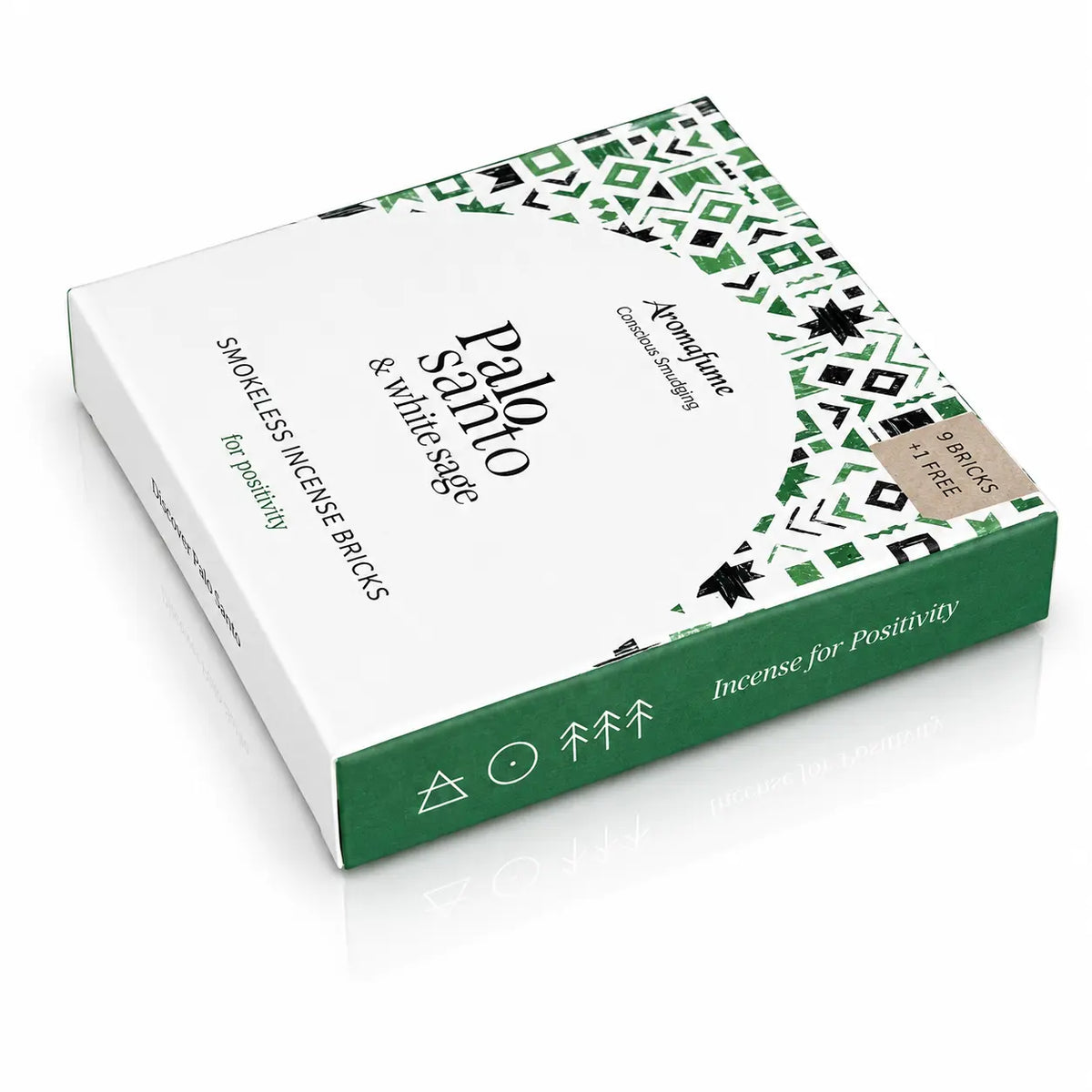 Briques d'encens Palo Santo et sauge blanche Aromafume, boîte rectangulaire blanche et verte ornée de motifs géométriques ethniques noirs et vert foncé avec tranches vertes.