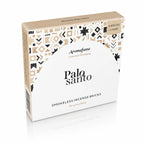 Briques d'encens Palo Santo Aromafume, boîte carrée beige et blanche ornée de motifs géométriques ethniques noirs et dorés avec un demi-cercle blanc central.