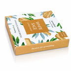 Briques d'encens Sauge blanche et Palo Santo Aromafume, packaging rectangulaire blanc illustré de feuilles et bâtonnets avec un carré ocre et tranche dorée.