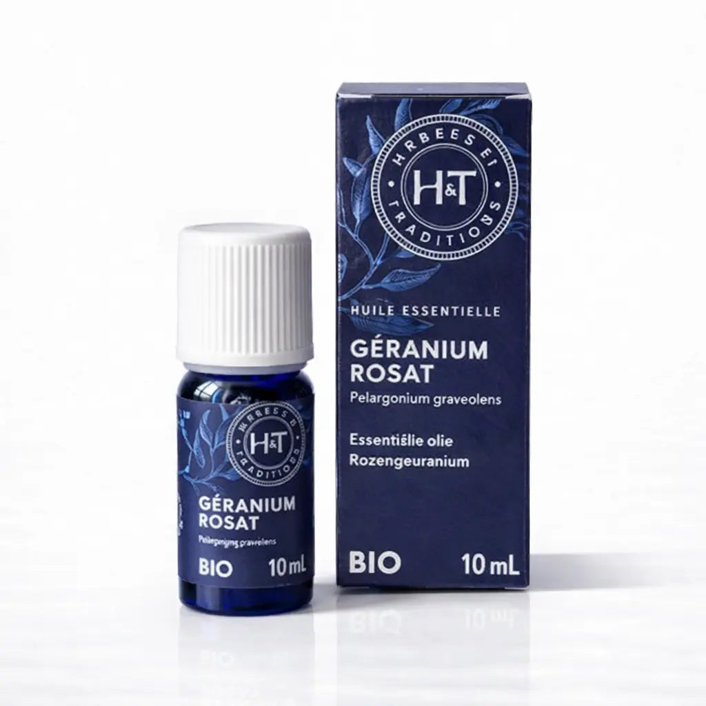 Un flacon de 10 ml et son étui d'huile essentielle de Géranium Rosat (Bio) de la marque Herbes & Traditions, présentés sur un fond blanc épuré.