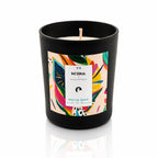 Bougie bijou Sensa x Nakupenda n°9 Escale Île Maurice dans un pot noir mat avec étiquette pop multicolore.