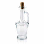 Une petite bouteille en verre transparent de type amphore avec anse et bouchon en liège, idéale pour contenir des élixirs ou des potions, présentée sur un fond blanc.