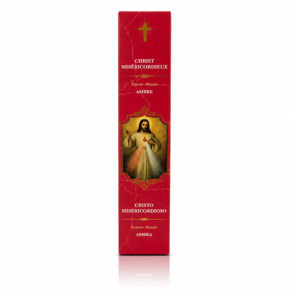 Encens religieux Christ Miséricordieux conditionné dans un étui cartonné rectangulaire rouge vif marbré, orné de l'illustration de Jésus, d'une croix dorée et de lettrages blancs.
