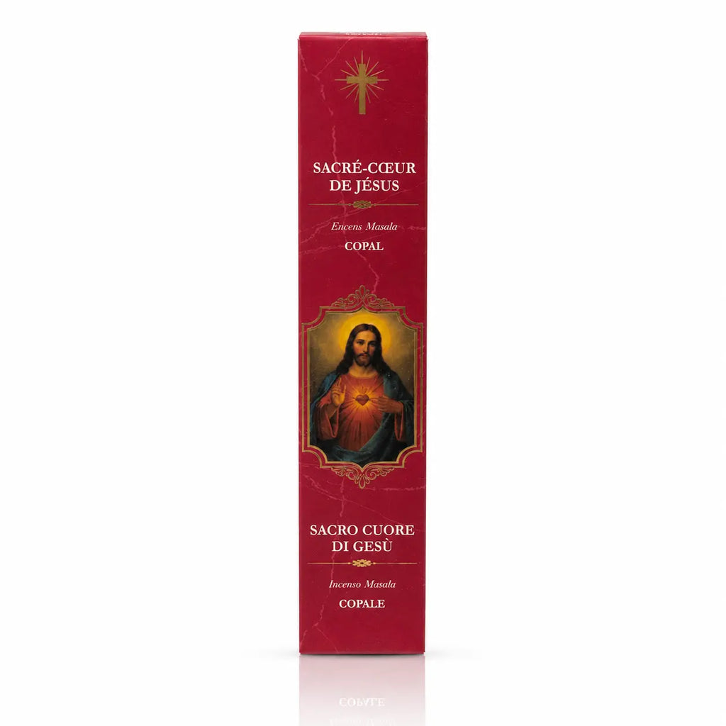 Encens religieux Sacré-Cœur de Jésus conditionné dans un étui cartonné rectangulaire rouge foncé marbré, illustré du Christ révélant son cœur rayonnant avec des lettrages blancs et dorés.