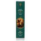 Encens religieux Saint Georges présenté dans un étui cartonné rectangulaire vert émeraude marbré, illustré du Saint terrassant le dragon sur un cheval blanc sous une croix dorée avec des inscriptions blanches.