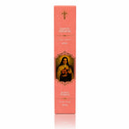 Encens religieux Sainte Thérèse présenté dans un étui cartonné rectangulaire rose saumon, illustré de la Sainte tenant un crucifix et des roses sous une croix dorée avec des inscriptions blanches.