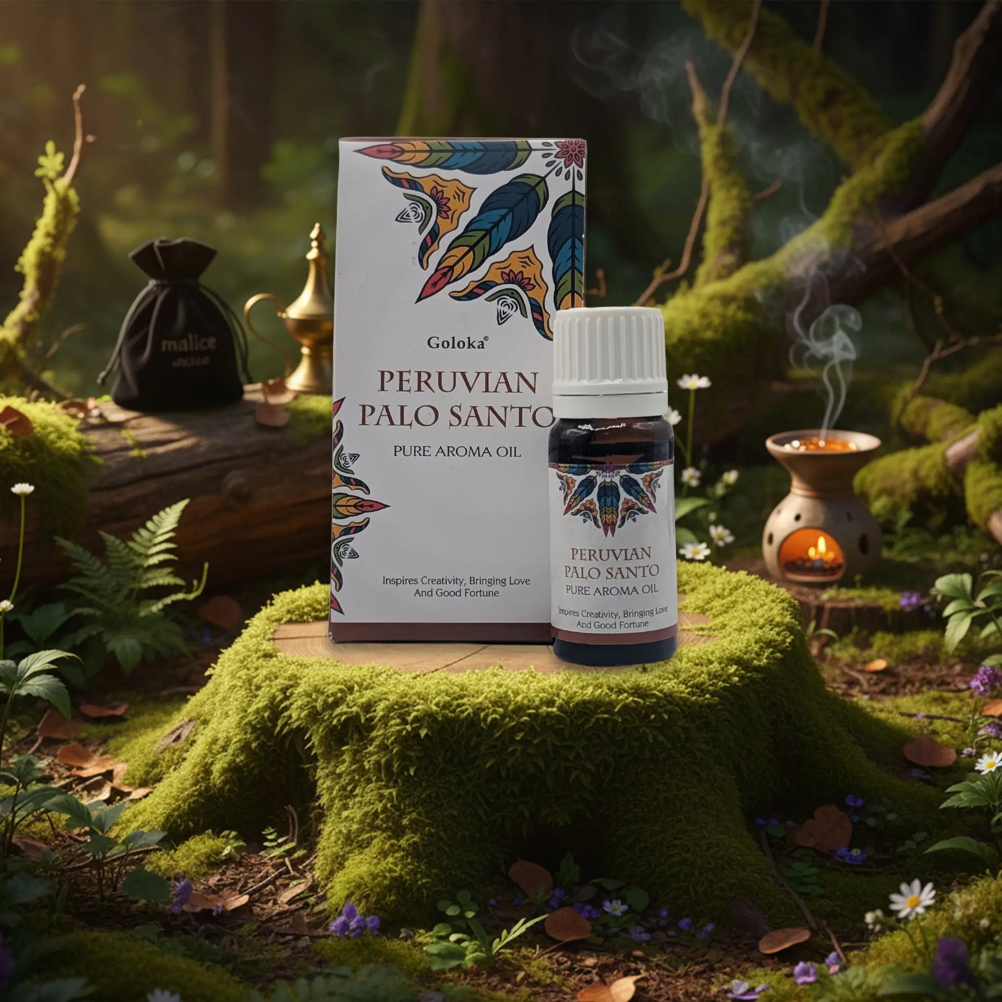 Huile aromatique Goloka « Peruvian Palo Santo » (Pure Aroma Oil) : le flacon (bouchon blanc) est placé devant sa boîte assortie, dans une mise en scène “forêt/mousse” avec un brûle-parfum allumé et un léger filet de fumée à droite.