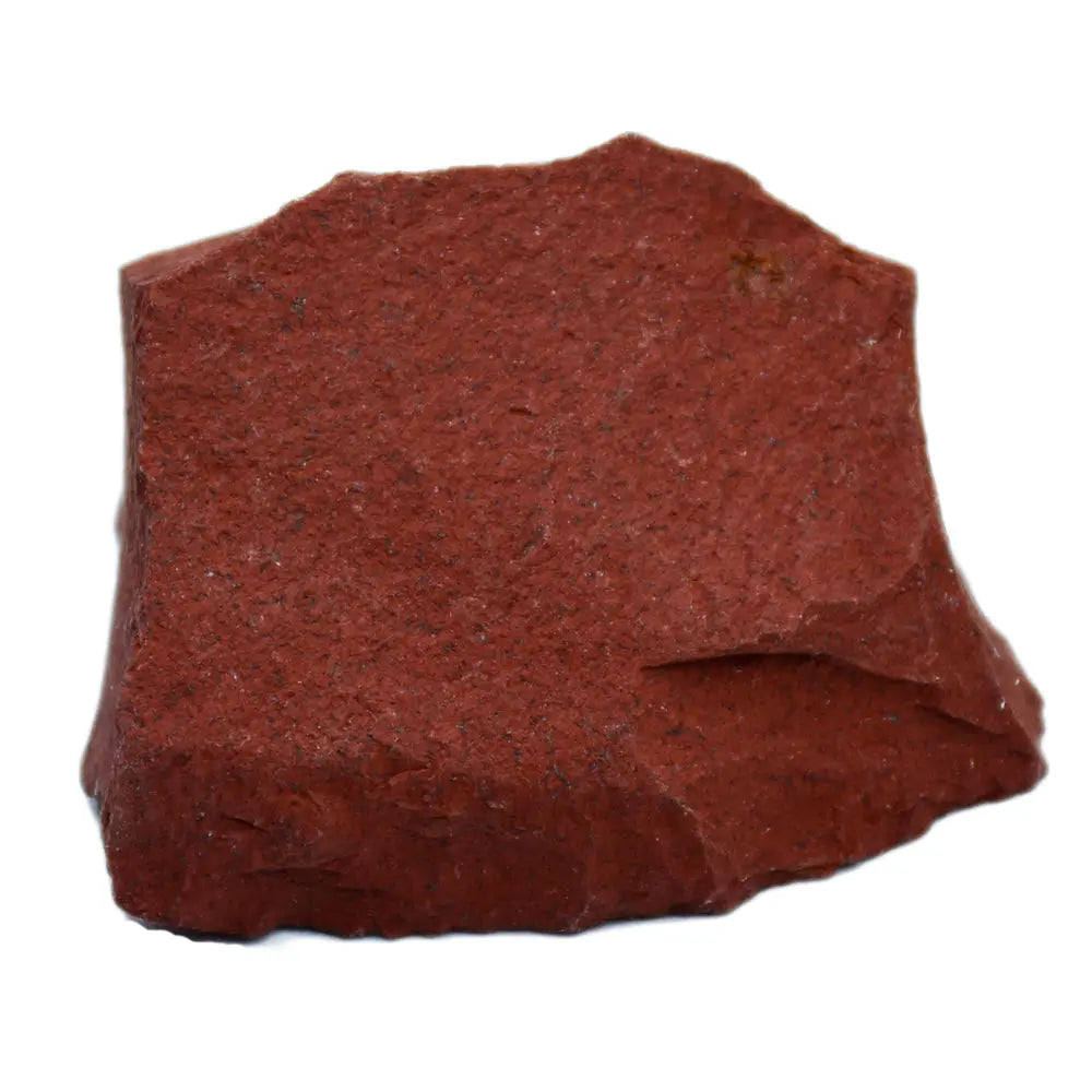 Bloc de jaspe rouge brut à l'unité, présentant une couleur rouge brique intense et une texture granuleuse naturelle sur fond blanc.