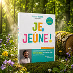 Livre blanc Je Jeûne ! de Romain Vicente posé dans un sous-bois ensoleillé, présentant un titre coloré et le portrait de l'auteur naturopathe.