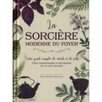 La Sorcière moderne du foyer d'Arin Murphy-Hiscock, illustré par sa couverture de face au style vintage sur fond crème, encadrée de plantes aromatiques, de champignons, d'une bouilloire ancienne et d'un mortier.