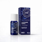Un flacon de 10 ml d'huile essentielle de lavande aspic bio de la marque Herbes & Traditions, accompagné de son étui en carton bleu foncé assorti, présenté sur un fond blanc.