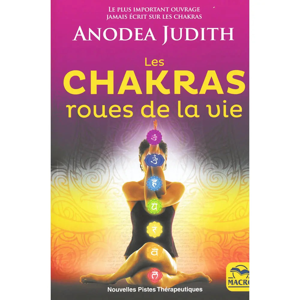 Les Chakras, roues de la vie de Anodea Judith, sa couverture illustrant une personne en posture de yoga sur laquelle sont alignés les sept chakras colorés, sur un fond dégradé violet et jaune lumineux.