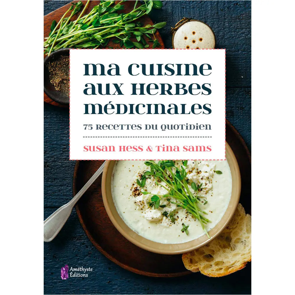 Ma cuisine aux herbes medicinales - 75 recettes du quotidien de Susan Hess & Tina Sams, sa couverture appétissante montrant un bol de soupe crémeuse parsemée d'herbes fraîches et de fromage, accompagnée d'un morceau de pain sur une table en bois sombre.