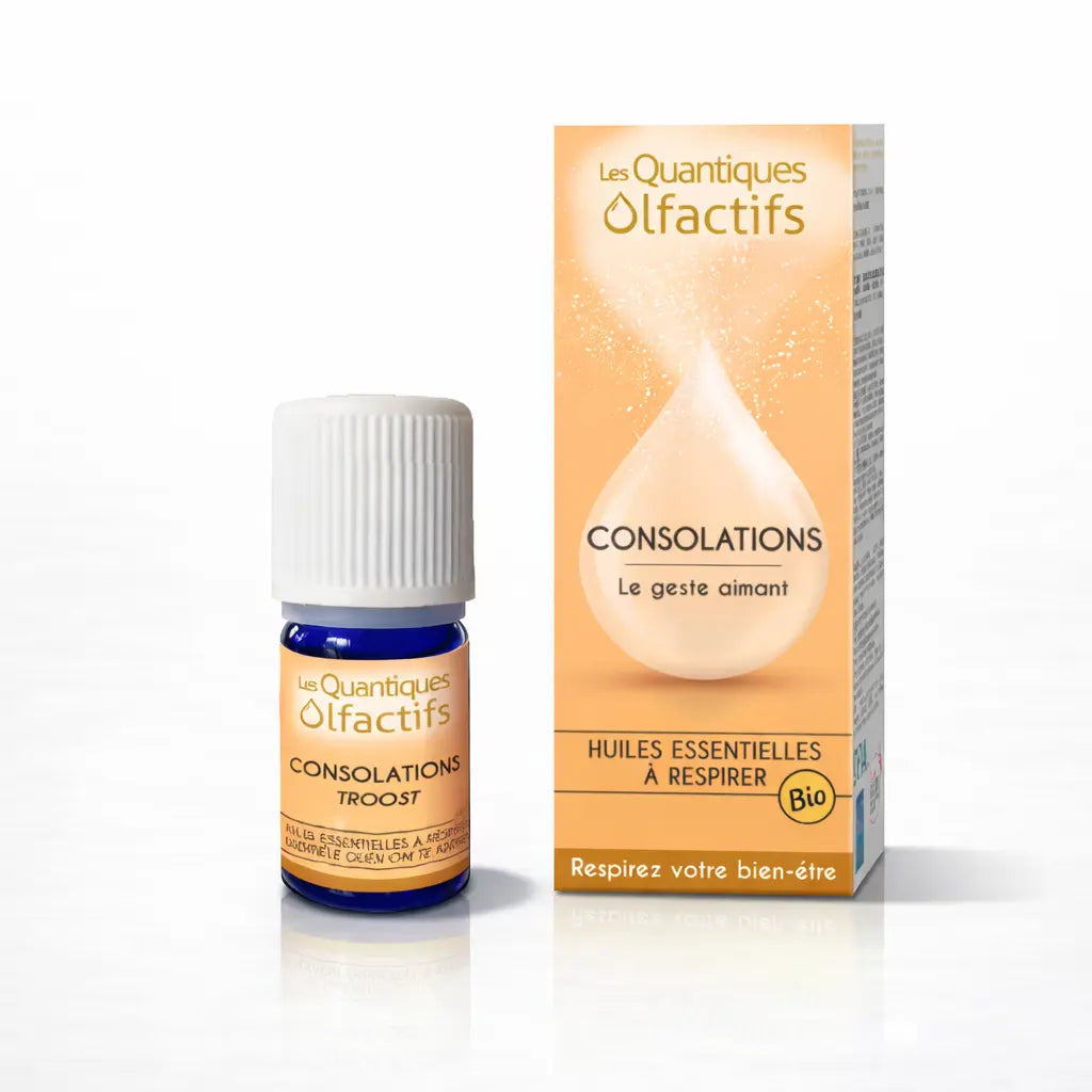 Un flacon de complexe d'huiles essentielles bio "Consolations" de la gamme Les Quantiques Olfactifs, accompagné de son étui de couleur pêche, présenté avec son reflet sur un fond blanc.
