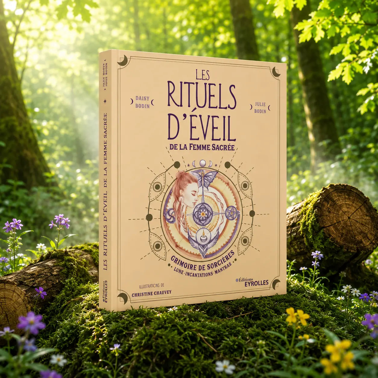 Livre Les Rituels d'Eveil de la Femme Sacrée - Daisy et Julie Bodin sur mousse sacrée au pied d'un arbre, entouré de fleurs violettes sous des rayons de soleil magiques.