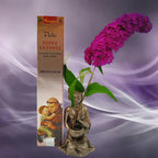 Boîte d'encens naturel Vedic Saint Antoine Miel Rose cuivrée avec illustration du saint tenant l'enfant Jésus, statuette de moine et fleur violette sur fond mauve