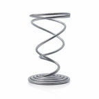 Support métallique en spirale argentée pour bâton d'encens, de sauge ou Palo Santo, sur fond blanc.