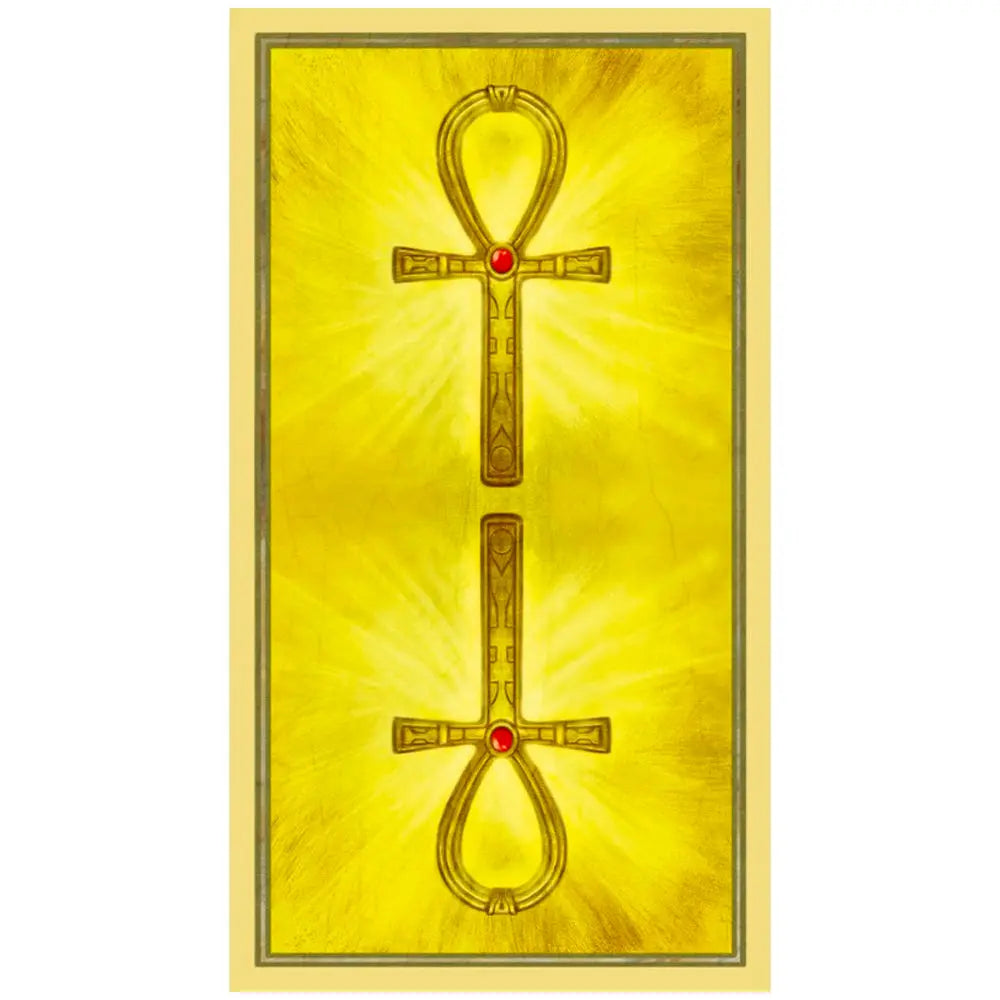 Dos de carte : fond jaune lumineux avec deux croix ansées (ankh) dorées, chacune avec un petit joyau rouge au centre.